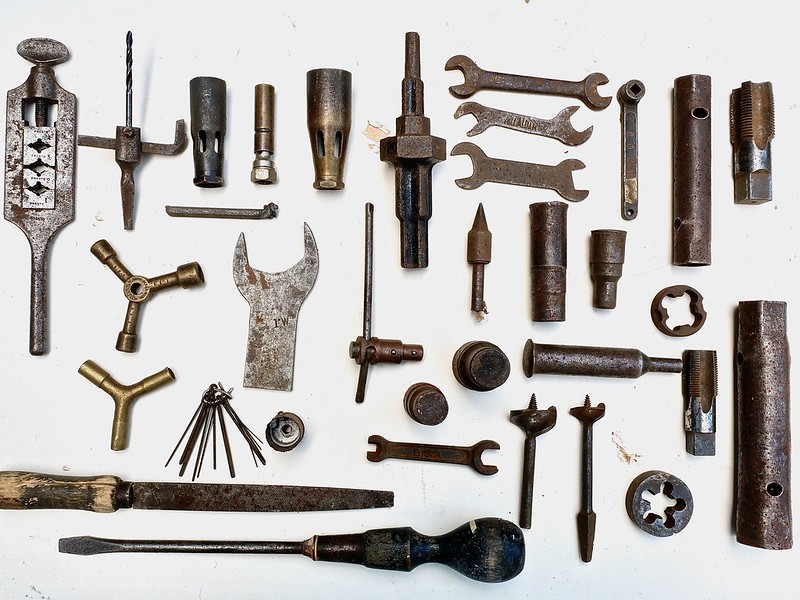 Photo of assortment of old plumbing tools.